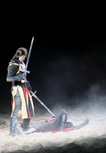 Mediaeval knight with rival on the ground demonstrating victory over enemies